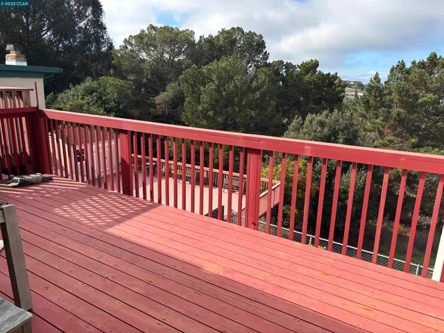 a backyard of a house with lots of green space and fountain