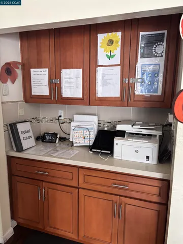 a kitchen with stainless steel appliances granite countertop a sink a stove cabinets and wooden floor