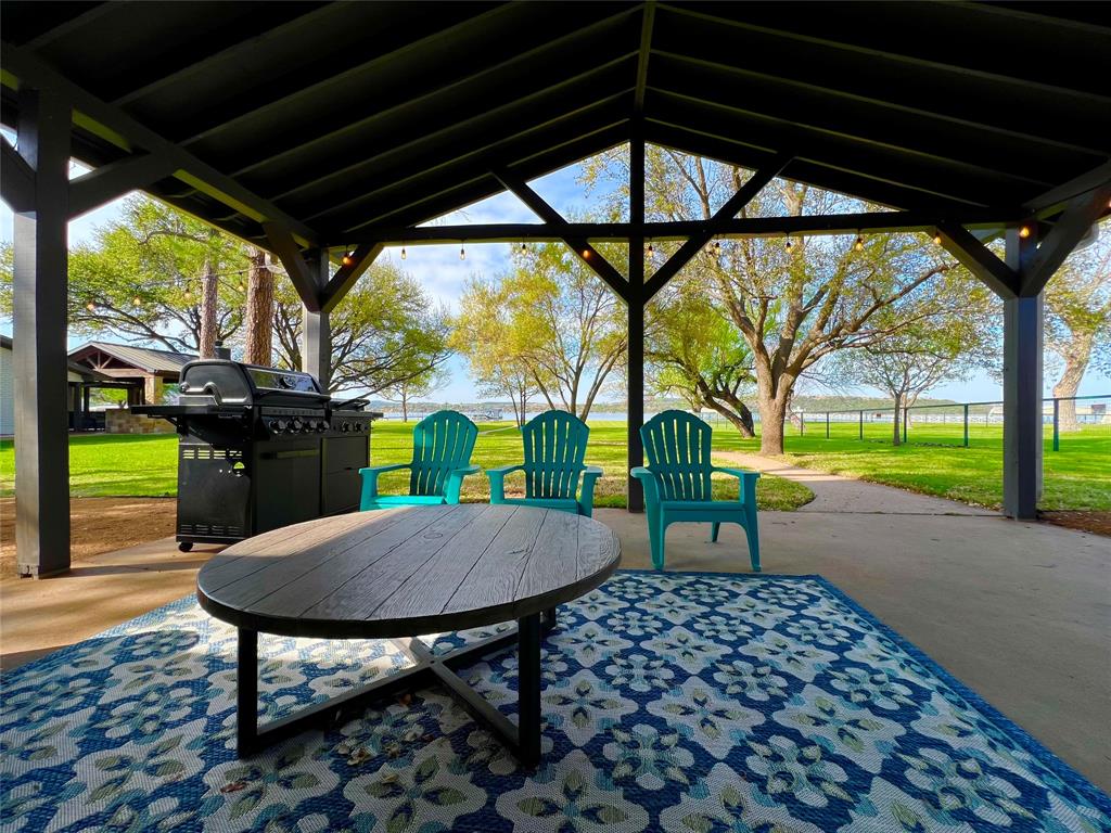 1957 Deer Trail Road Graford, TX 76449 - Photo 7 of 32 a view of a porch with furniture and a yard