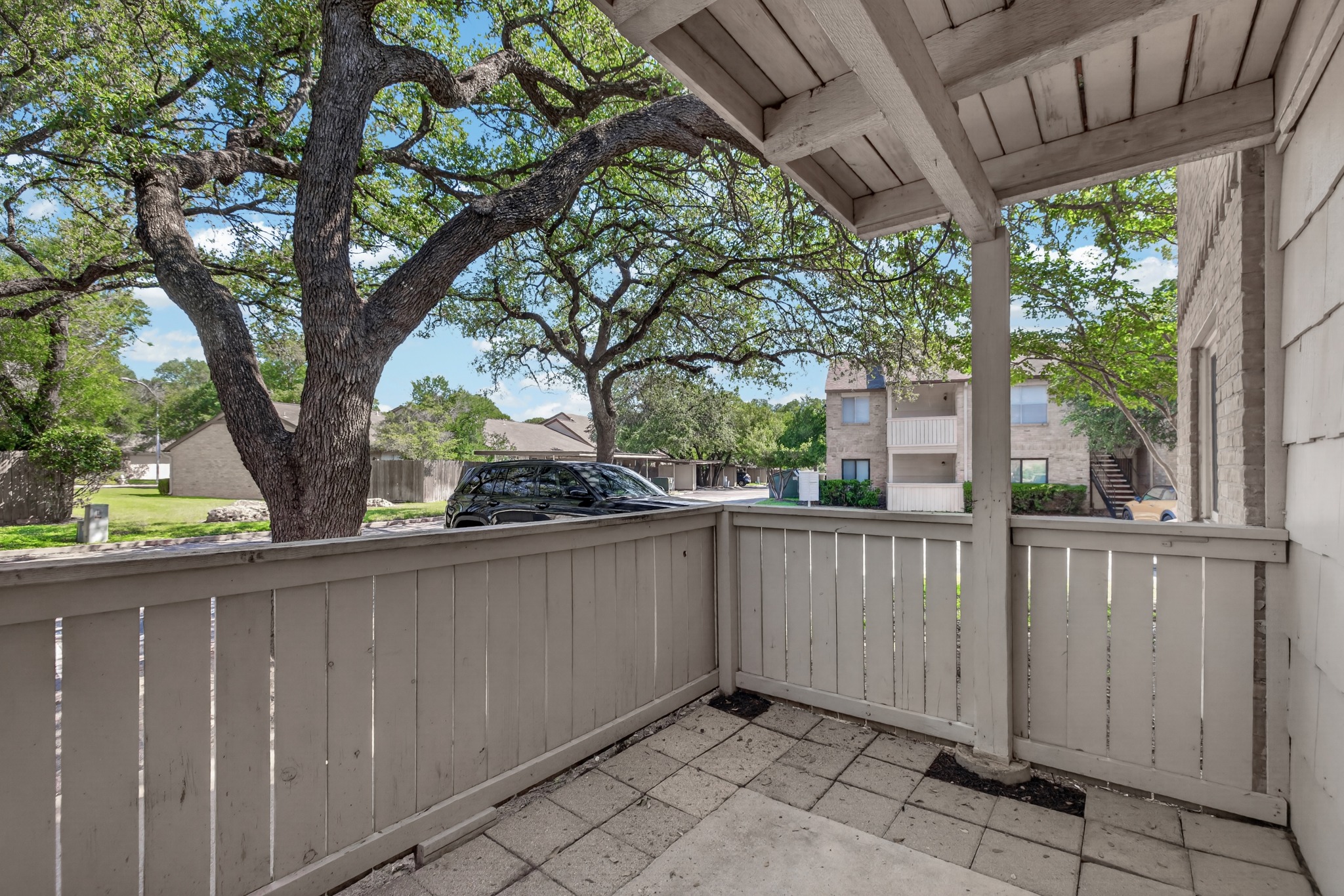 8210 Bent Tree Road, Unit 116 Austin, TX 78759 - Photo 24 of 25 a view of a house with a backyard and a patio