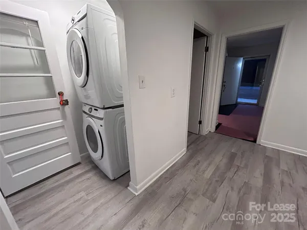 a view of a storage and utility room with washer and dryer