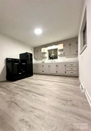 a view of a bedroom with closet and cabinet