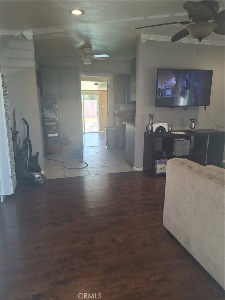 14502 South Keene Avenue Compton, CA 90220 - Photo 3 of 6 a living room with furniture and a flat screen tv