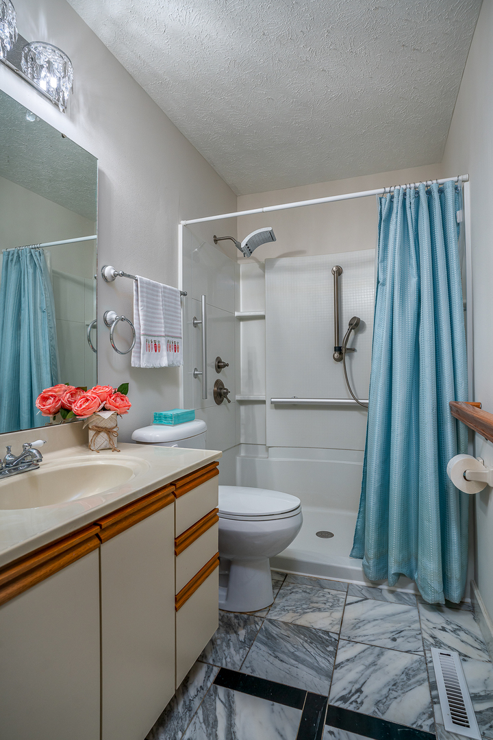 4231 26th Avenue Moline, IL 61265 - Photo 16 of 18 a bathroom with a sink toilet and shower