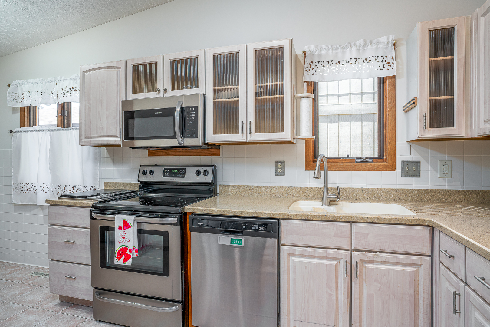 4231 26th Avenue Moline, IL 61265 - Photo 4 of 18 a kitchen with stainless steel appliances granite countertop a sink stove and cabinets