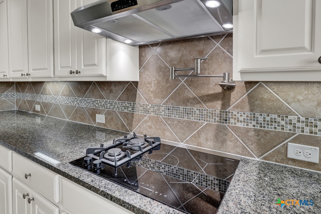 2194 Ranch Loop Drive New Braunfels, TX 78132 - Photo 12 of 48 a stove top oven sitting inside of a kitchen