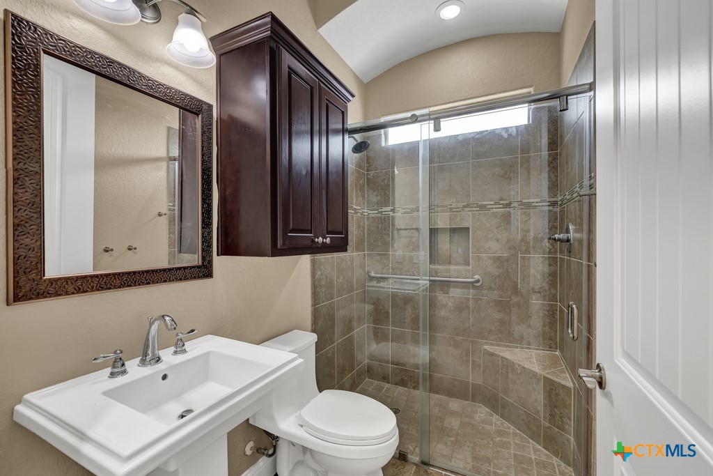 2194 Ranch Loop Drive New Braunfels, TX 78132 - Photo 20 of 48 a bathroom with a sink toilet and shower