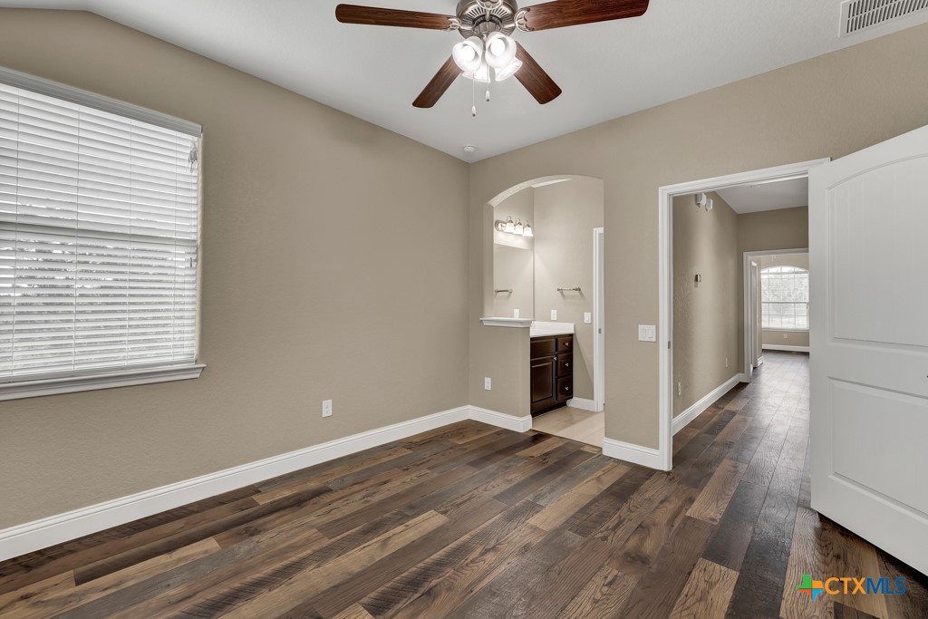 2194 Ranch Loop Drive New Braunfels, TX 78132 - Photo 26 of 48 a view of an empty room with wooden floor and a window