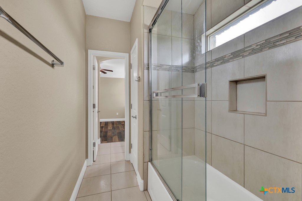 2194 Ranch Loop Drive New Braunfels, TX 78132 - Photo 27 of 48 a bathroom with a shower and a glass door