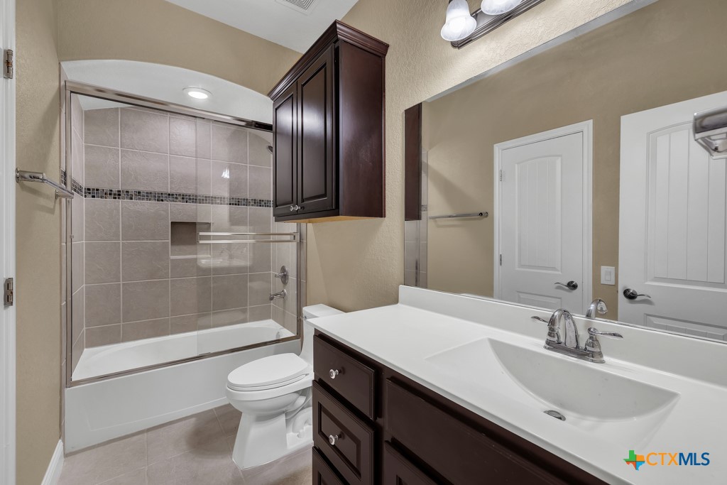 2194 Ranch Loop Drive New Braunfels, TX 78132 - Photo 29 of 48 a bathroom with a sink a toilet and shower
