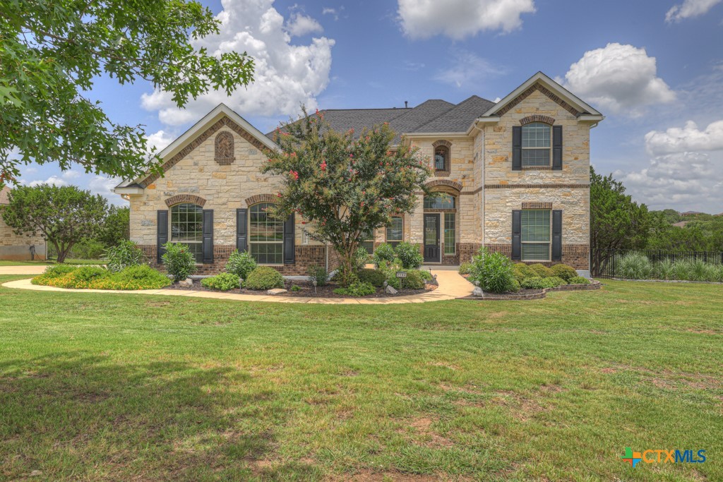 2194 Ranch Loop Drive New Braunfels, TX 78132 - Photo 3 of 48 a view of a house with a big yard potted plants and large tree