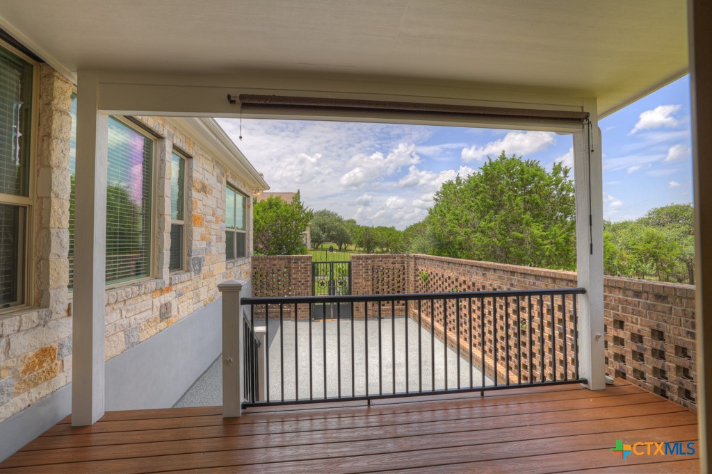 2194 Ranch Loop Drive New Braunfels, TX 78132 - Photo 34 of 48 a view of a balcony with wooden floor