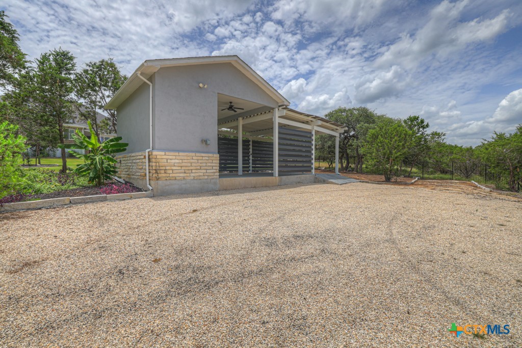 2194 Ranch Loop Drive New Braunfels, TX 78132 - Photo 41 of 48 a front view of a house with a yard and garage