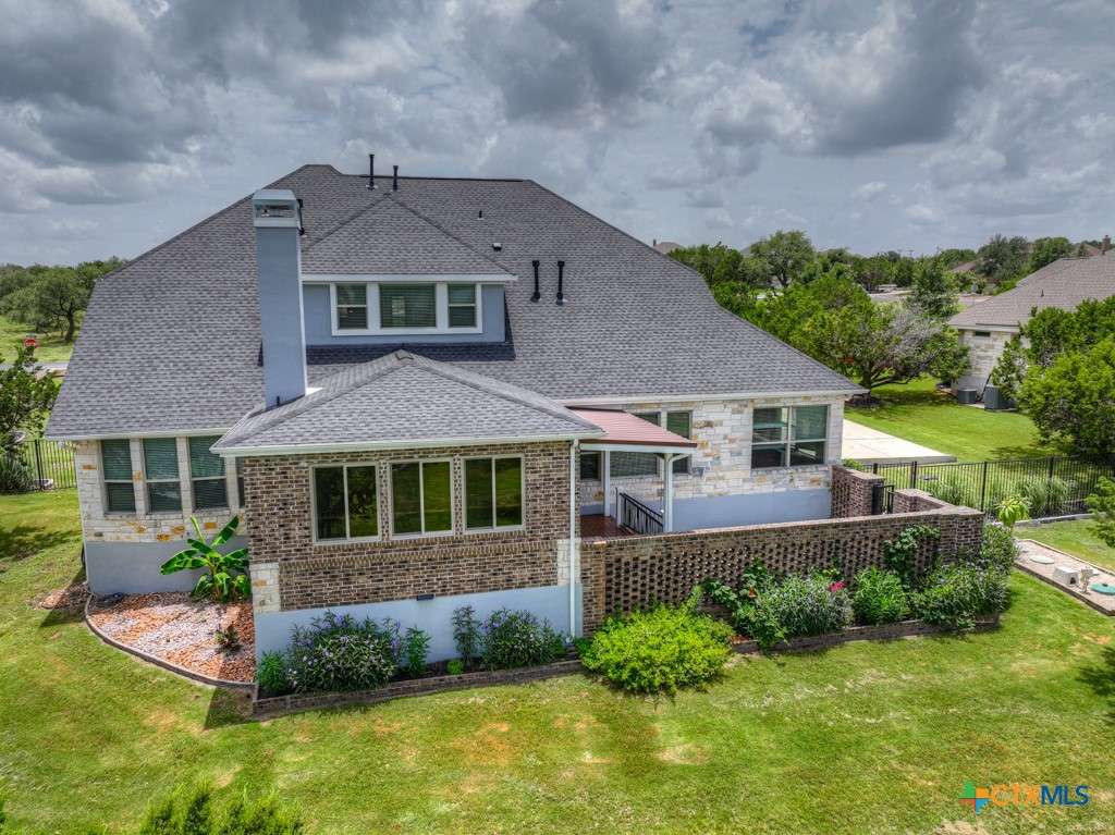 2194 Ranch Loop Drive New Braunfels, TX 78132 - Photo 46 of 48 front view of a house with a yard