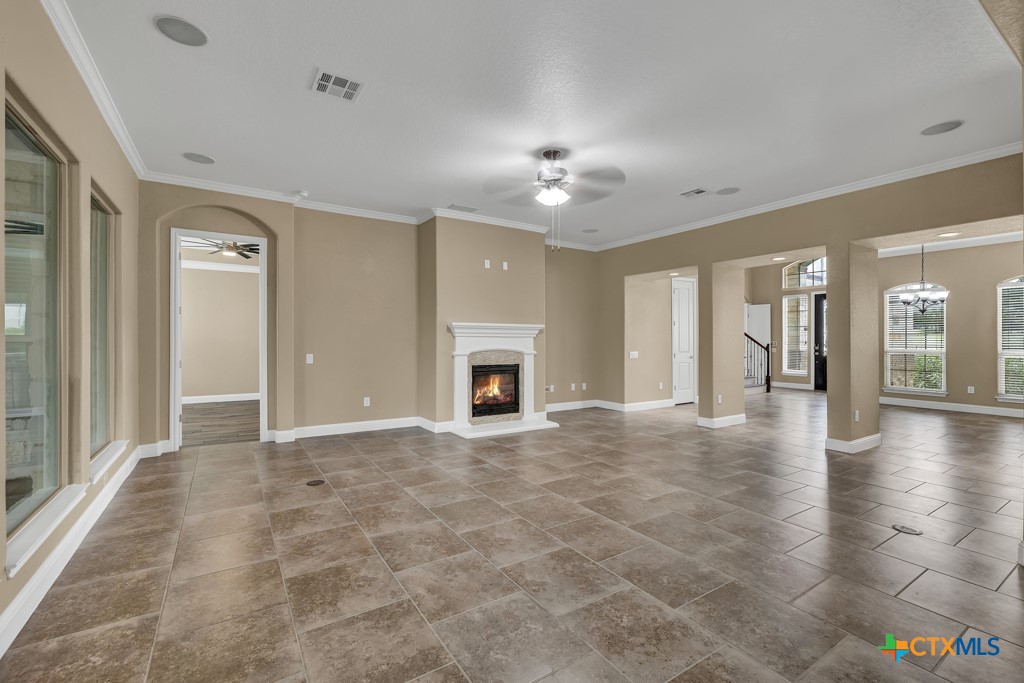 2194 Ranch Loop Drive New Braunfels, TX 78132 - Photo 8 of 48 a view of an empty room with a fireplace and a window