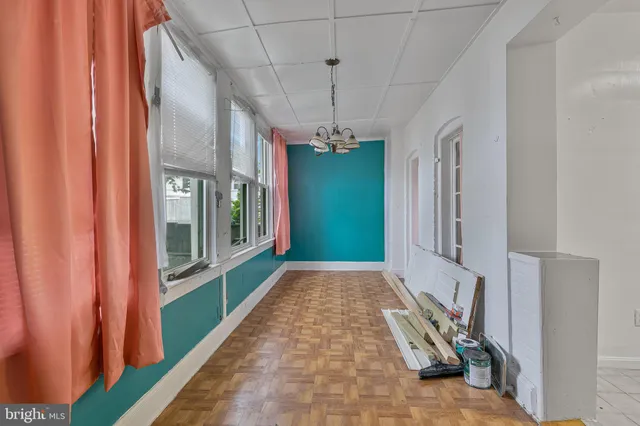 a view of a hallway with windows