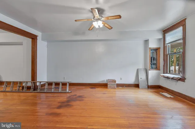 a view of a livingroom with furniture nad wooden floor