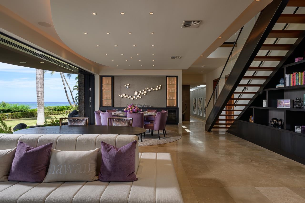 4809 Lower Honoapiilani Road Lahaina, HI 96761 - Photo 12 of 49 a living room with furniture and a floor to ceiling window
