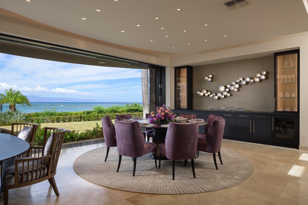 4809 Lower Honoapiilani Road Lahaina, HI 96761 - Photo 16 of 49 a view of a dining room with furniture window and wooden floor