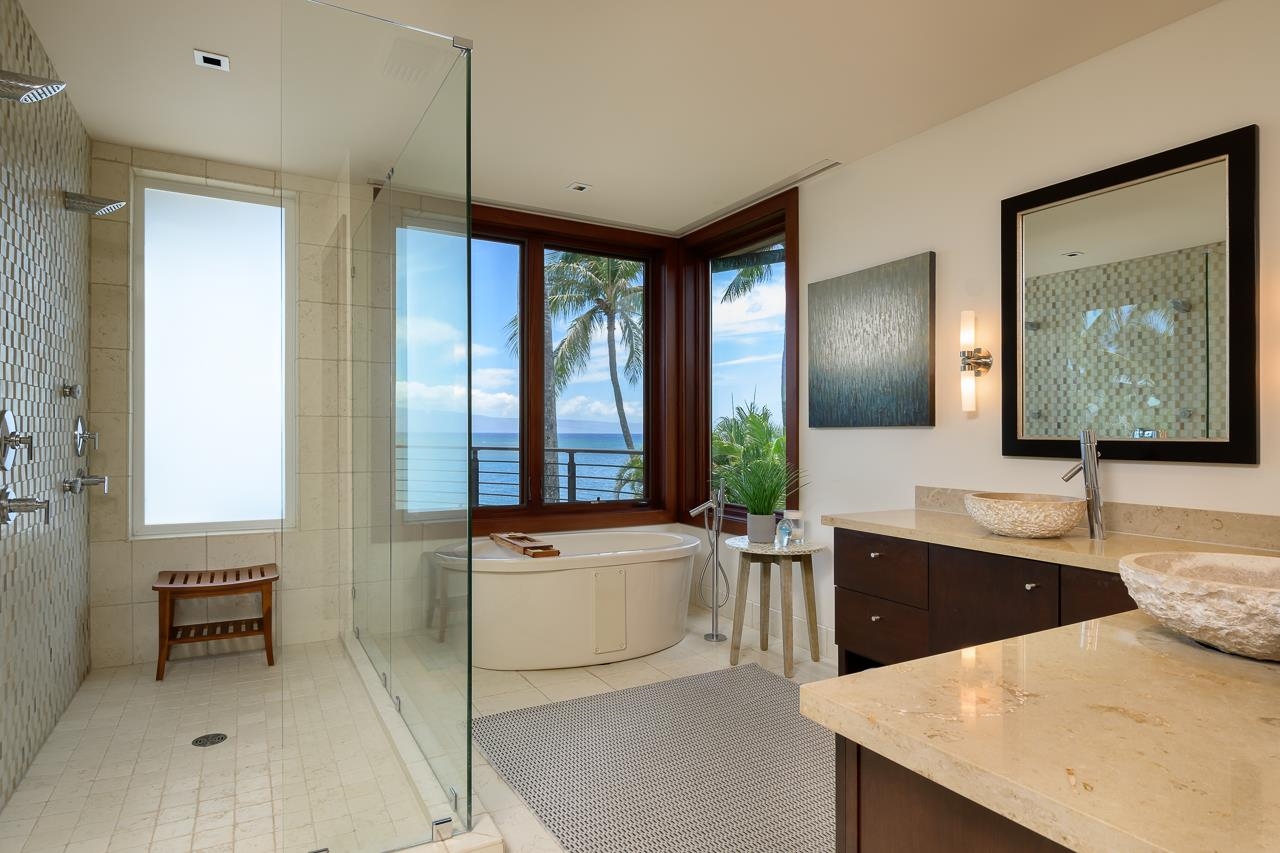 4809 Lower Honoapiilani Road Lahaina, HI 96761 - Photo 32 of 49 a large living room with stainless steel appliances kitchen island granite countertop furniture and a large window