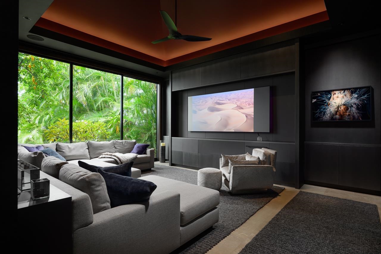 4809 Lower Honoapiilani Road Lahaina, HI 96761 - Photo 34 of 49 a living room with furniture and a flat screen tv