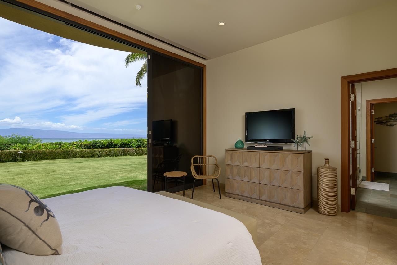 4809 Lower Honoapiilani Road Lahaina, HI 96761 - Photo 35 of 49 a room with furniture and a flat screen tv