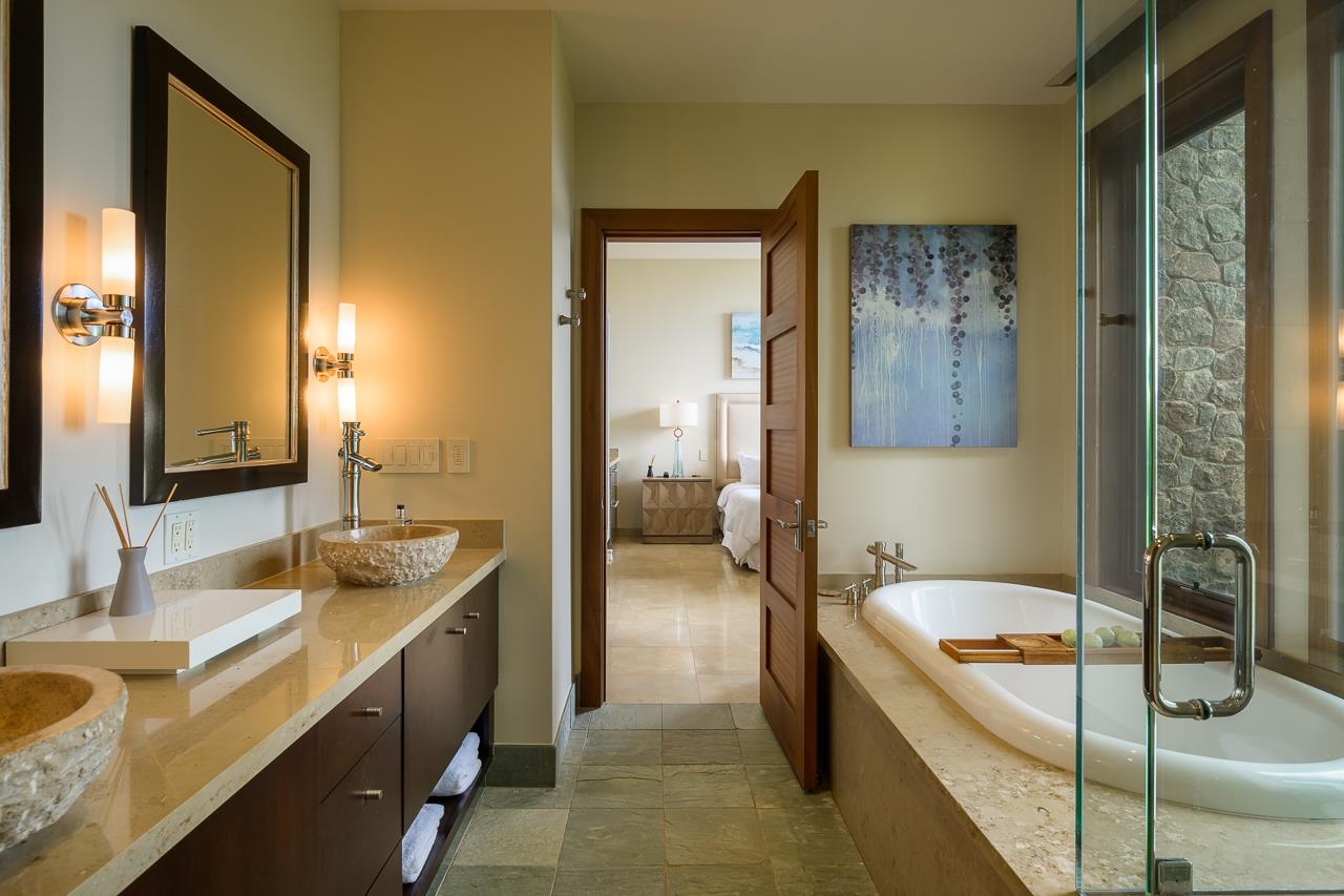 4809 Lower Honoapiilani Road Lahaina, HI 96761 - Photo 36 of 49 a bathroom with a tub a sink and a mirror