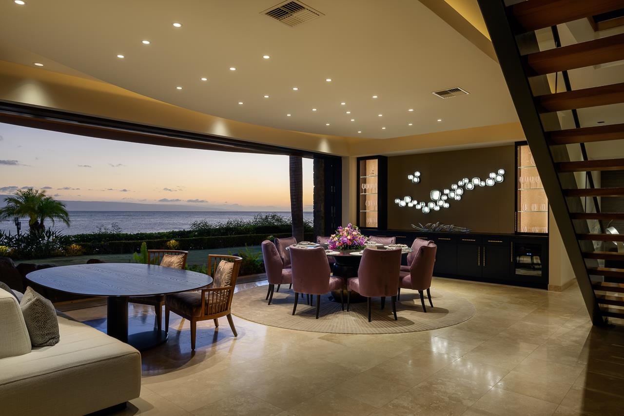 4809 Lower Honoapiilani Road Lahaina, HI 96761 - Photo 46 of 49 a dining room with furniture and a floor to ceiling window