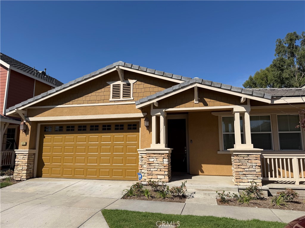 a front view of a house with garage
