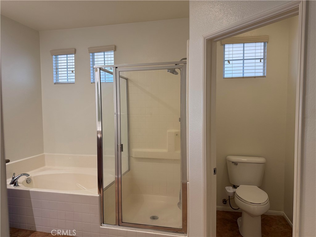 11012 Ragsdale Road Loma Linda, CA 92354 - Photo 14 of 27 a bathroom with a shower a toilet and a bathtub