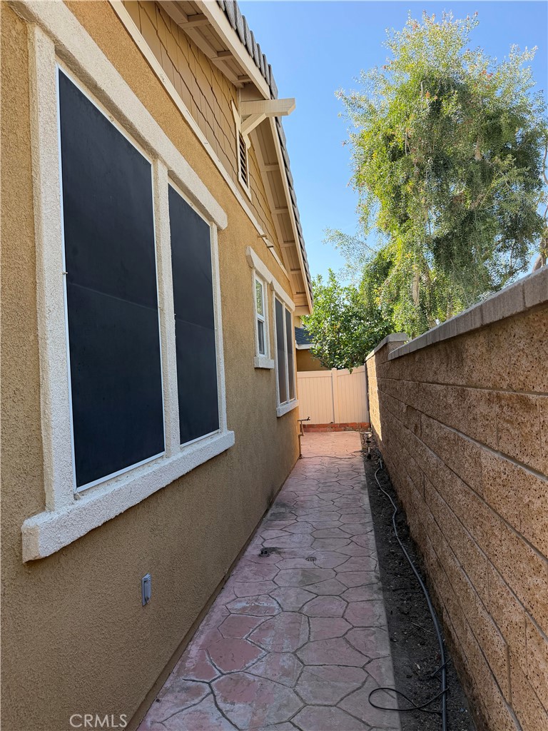 11012 Ragsdale Road Loma Linda, CA 92354 - Photo 26 of 27 a view of a pathway both side of house