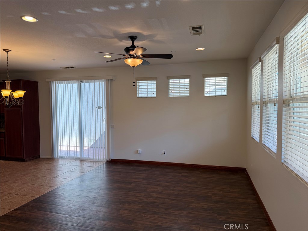 11012 Ragsdale Road Loma Linda, CA 92354 - Photo 4 of 27 an empty room with wooden floor and natural light