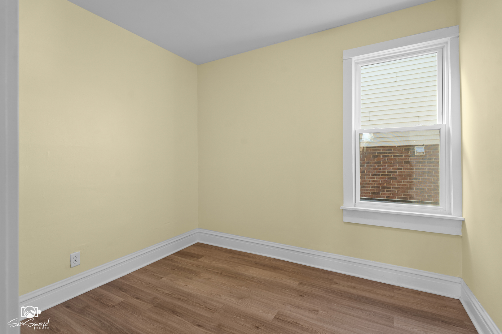 7236 West 63rd Place, Unit A Summit, IL 60501 - Photo 11 of 19 a view of an empty room with wooden floor and a window