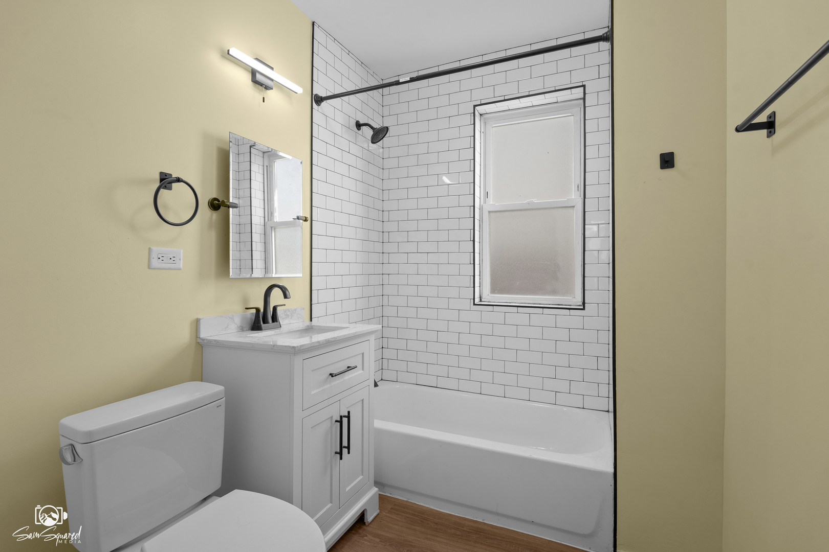 7236 West 63rd Place, Unit A Summit, IL 60501 - Photo 13 of 19 a bathroom with a toilet sink vanity and shower