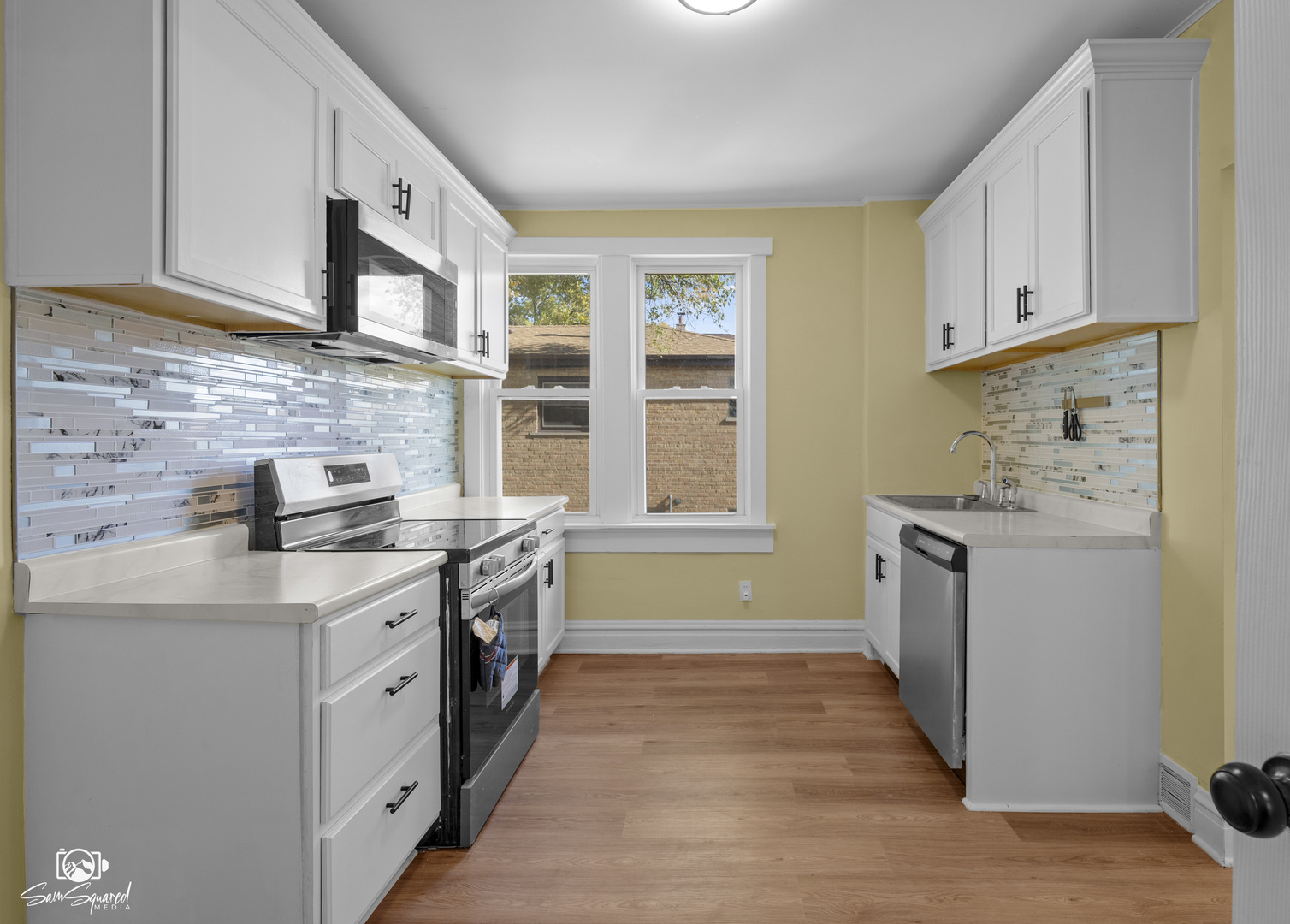 7236 West 63rd Place, Unit A Summit, IL 60501 - Photo 15 of 19 a kitchen with stainless steel appliances granite countertop a stove and a sink