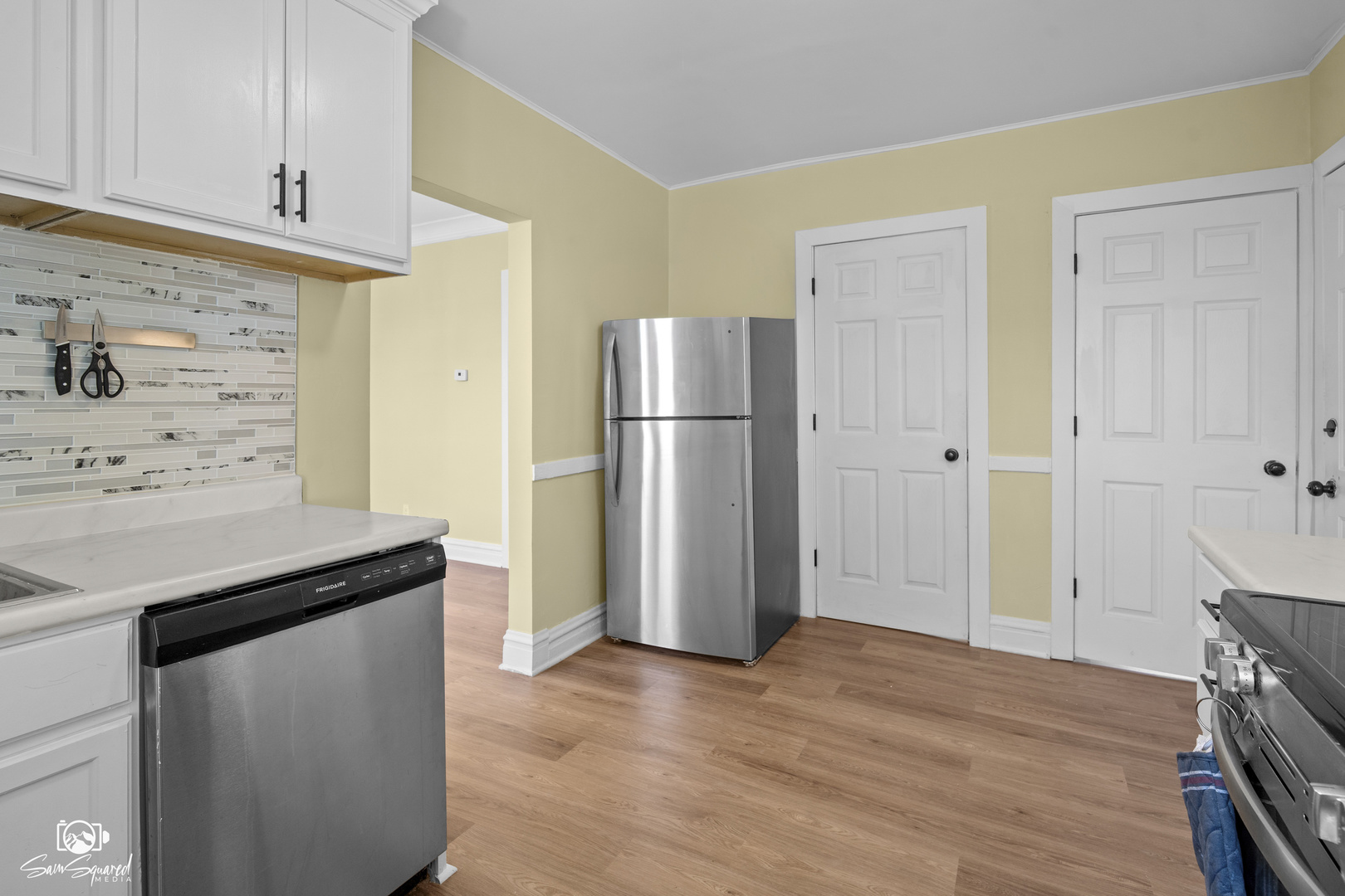 7236 West 63rd Place, Unit A Summit, IL 60501 - Photo 16 of 19 a kitchen with a refrigerator and a stove top oven