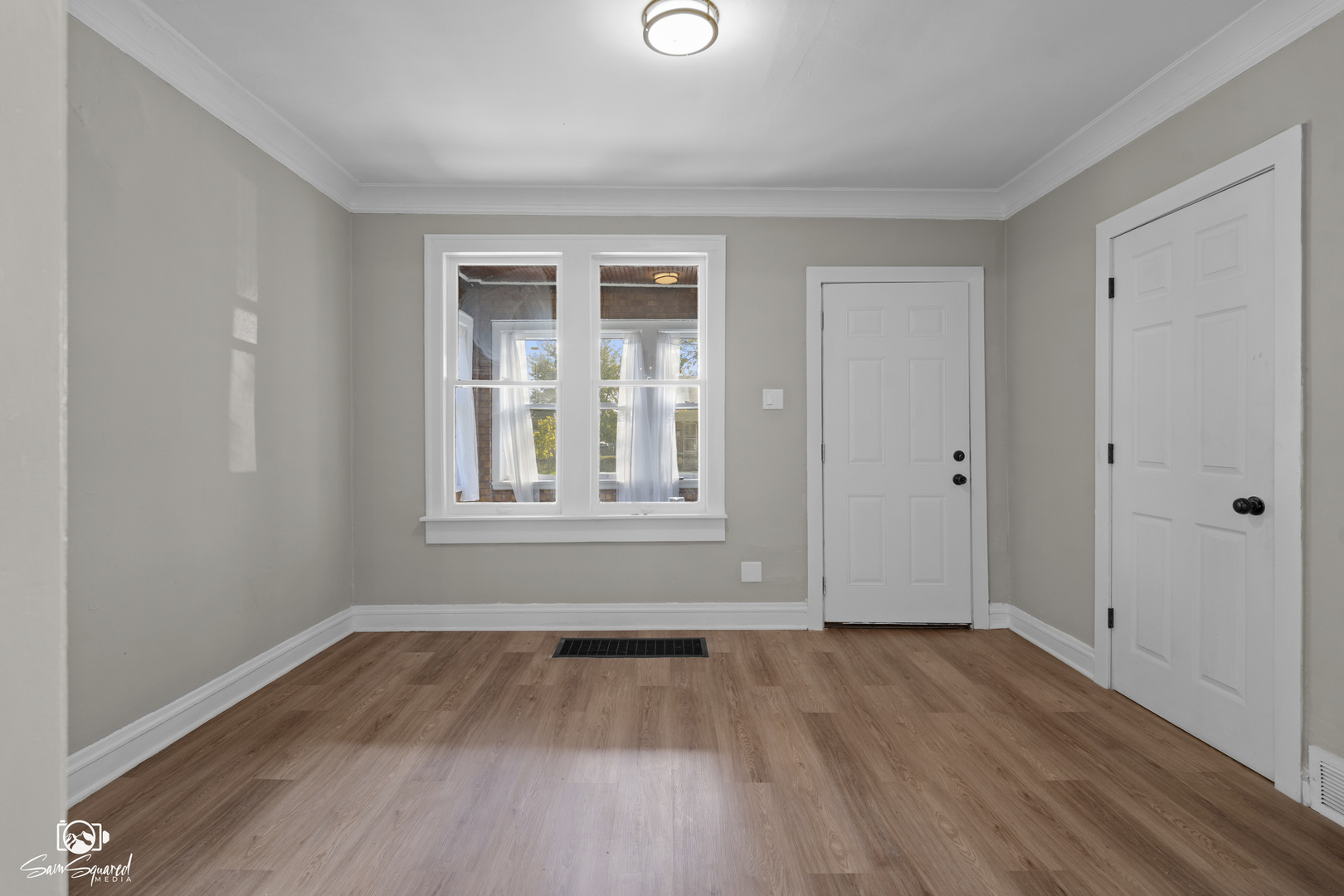 7236 West 63rd Place, Unit A Summit, IL 60501 - Photo 4 of 19 a view of empty room with wooden floor and fan
