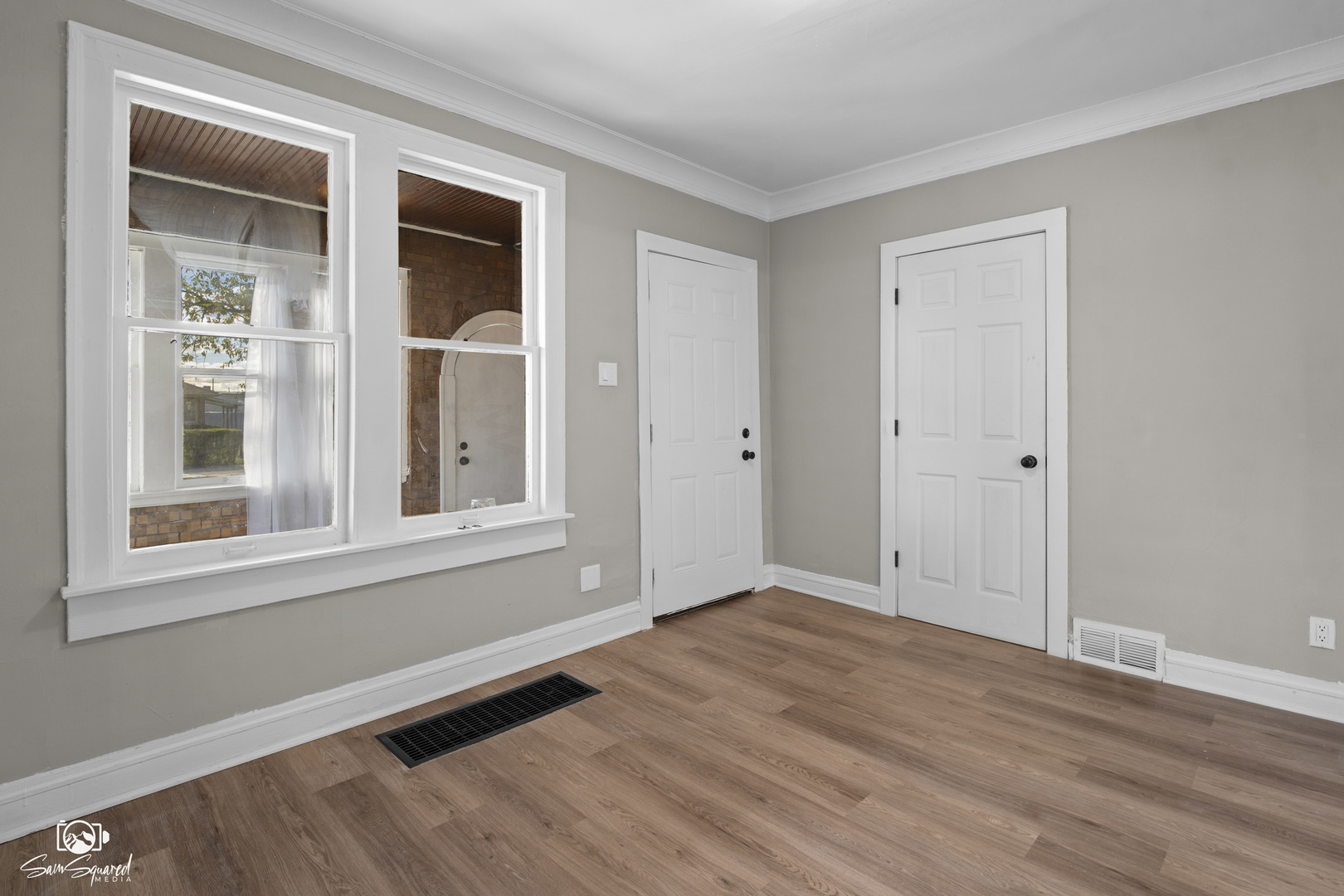 7236 West 63rd Place, Unit A Summit, IL 60501 - Photo 5 of 19 a view of an empty room with wooden floor and a window