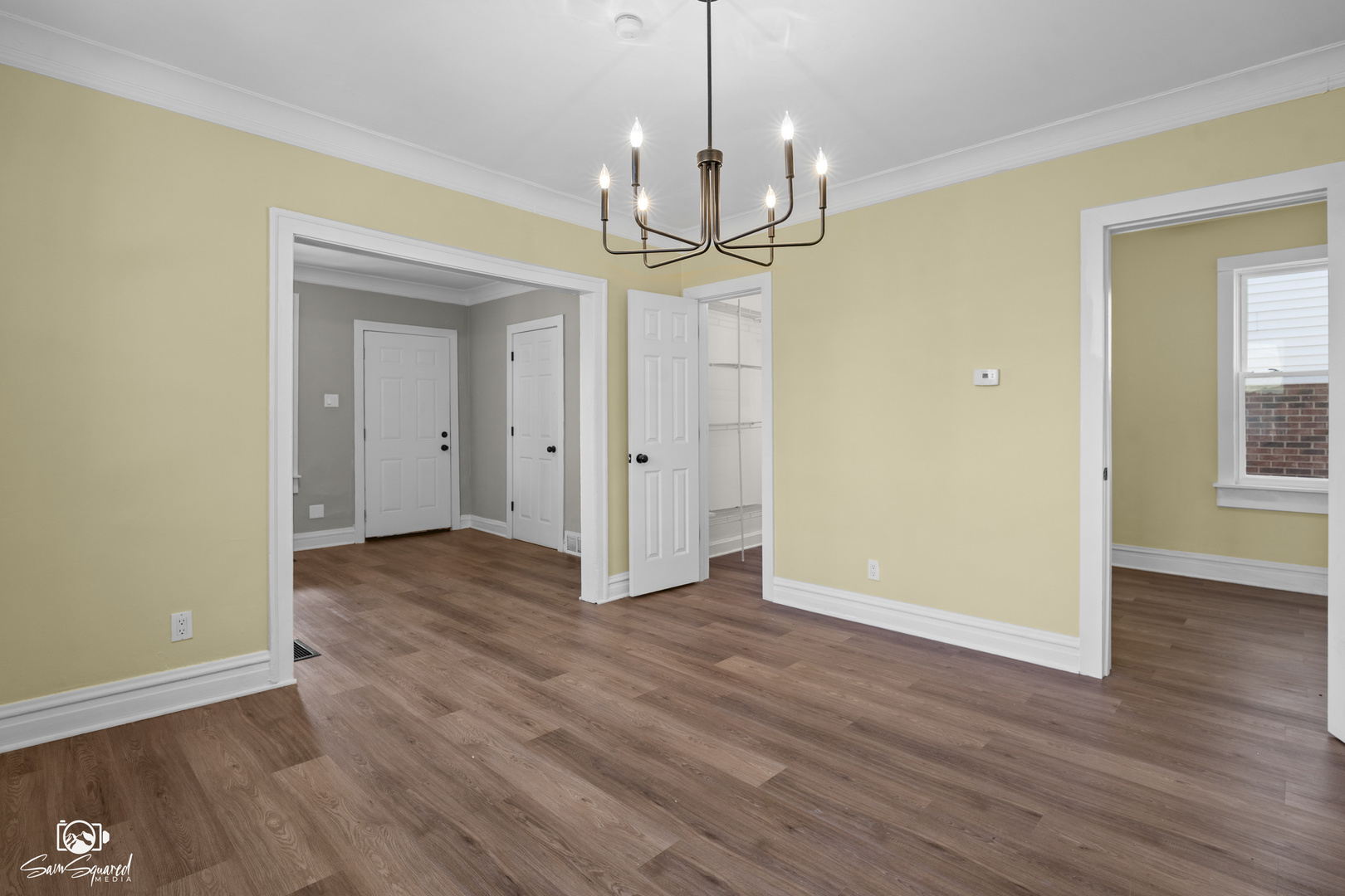 7236 West 63rd Place, Unit A Summit, IL 60501 - Photo 9 of 19 a view of a room with wooden floor chandelier and windows