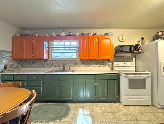 a kitchen with a stove and a sink