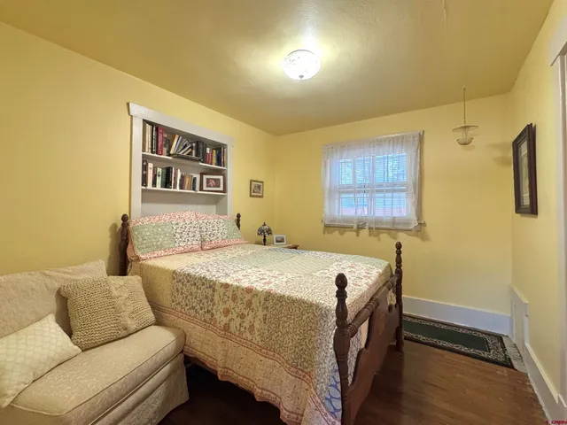 a bed room with a bed and a couch