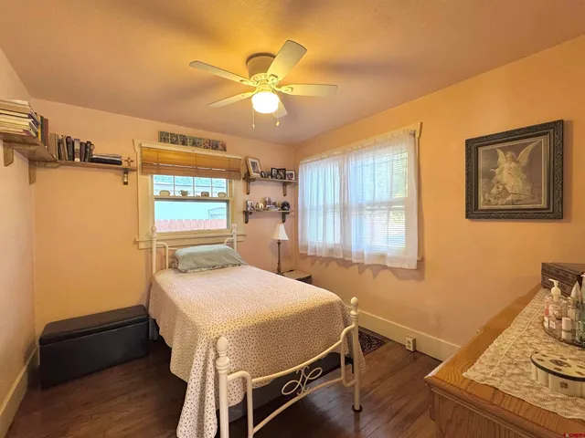 a bedroom with a bed and a table