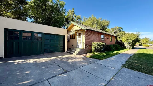 a backyard of a house with seating space