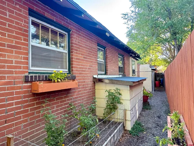 a front view of house with yard and outdoor seating