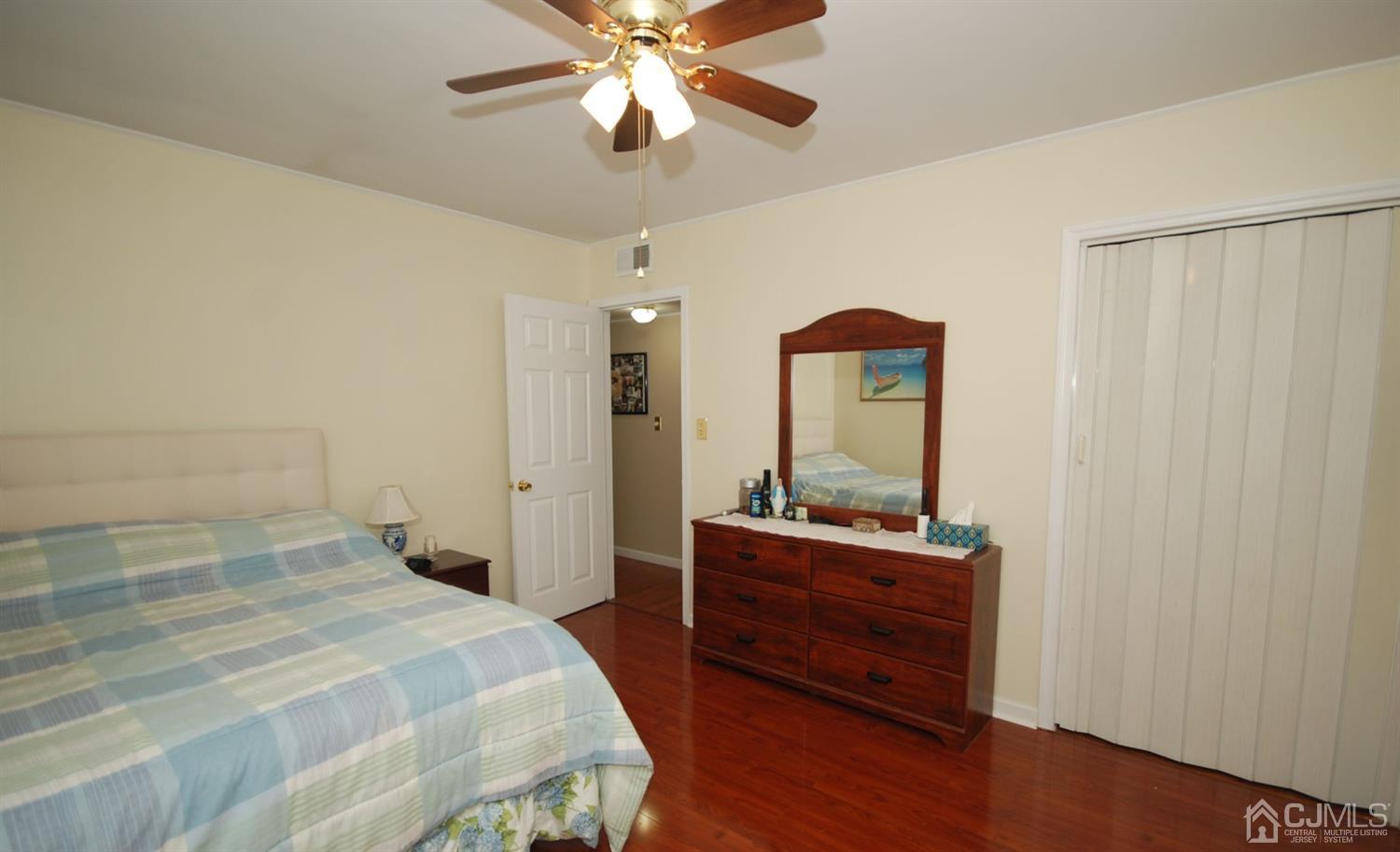 243 Old Post Road Edison, NJ 08817 - Photo 14 of 26 a bedroom with a bed and a dresser