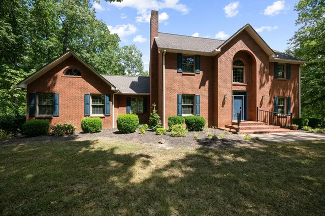 a front view of a house with yard