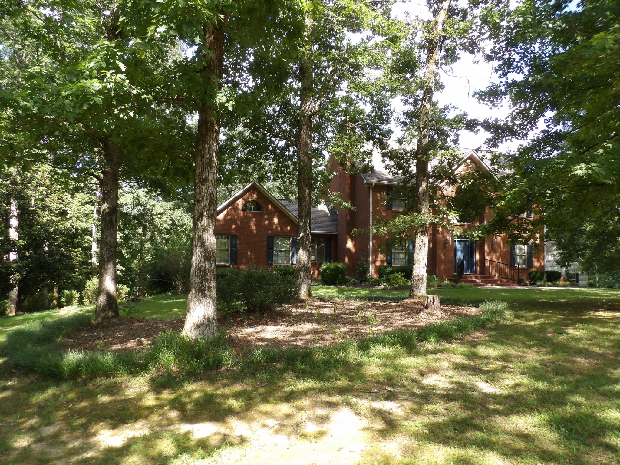 570 Gregson Place Waverly, TN 37185 - Photo 14 of 77 a backyard of a house with lots of green space