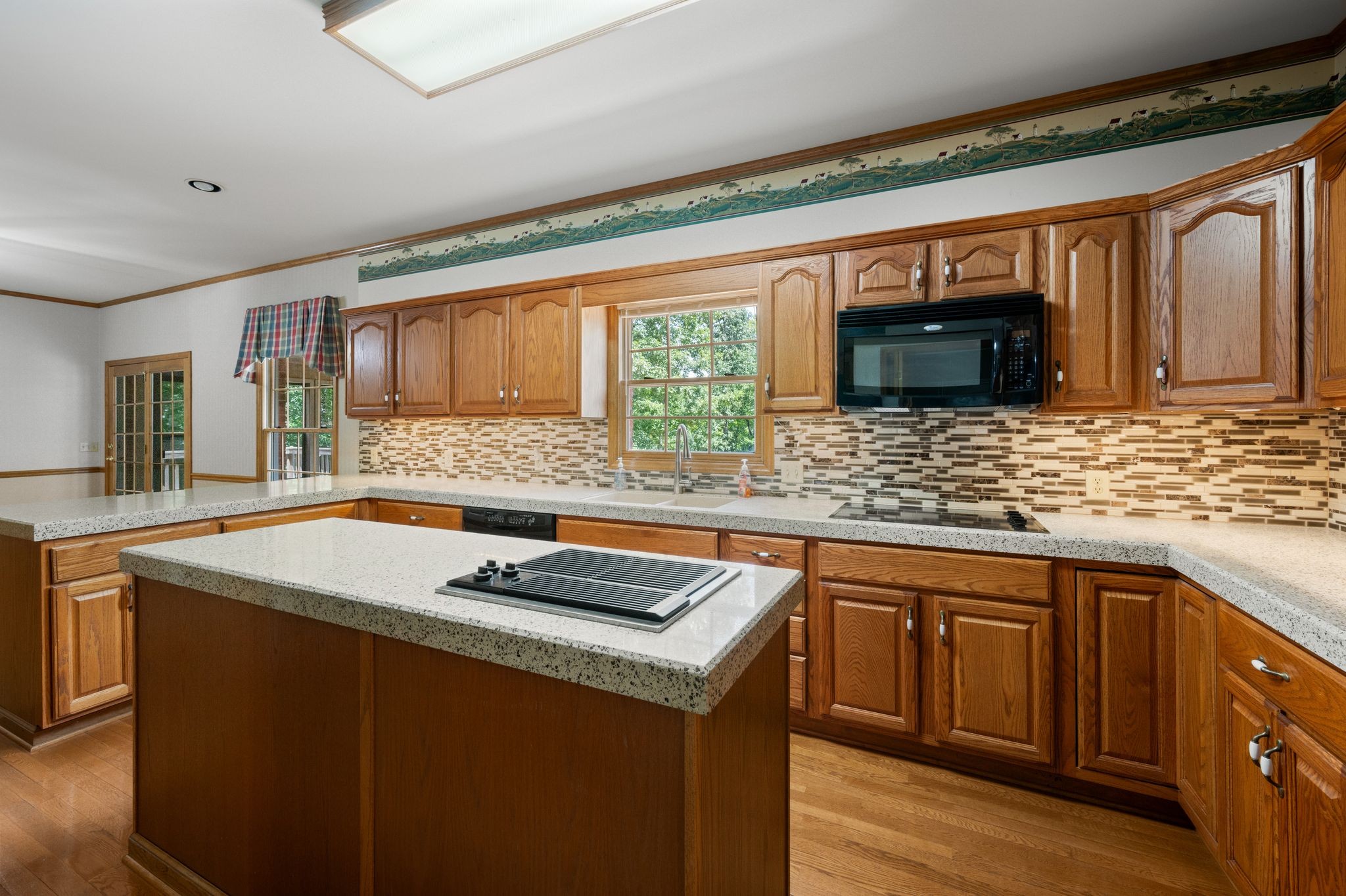 570 Gregson Place Waverly, TN 37185 - Photo 24 of 77 a kitchen with stainless steel appliances granite countertop a sink stove and cabinets