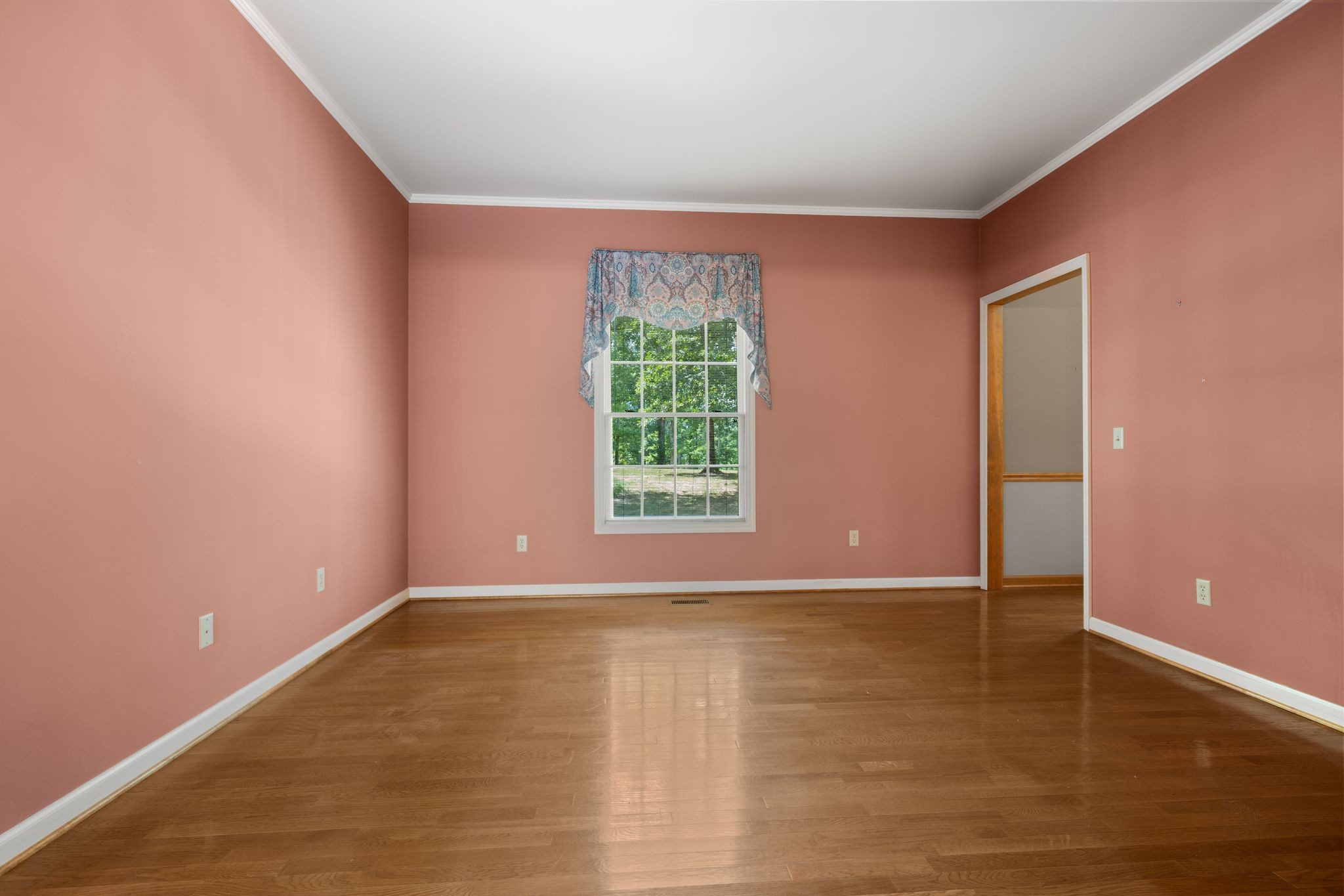 570 Gregson Place Waverly, TN 37185 - Photo 31 of 77 a view of an empty room with wooden floor and a window