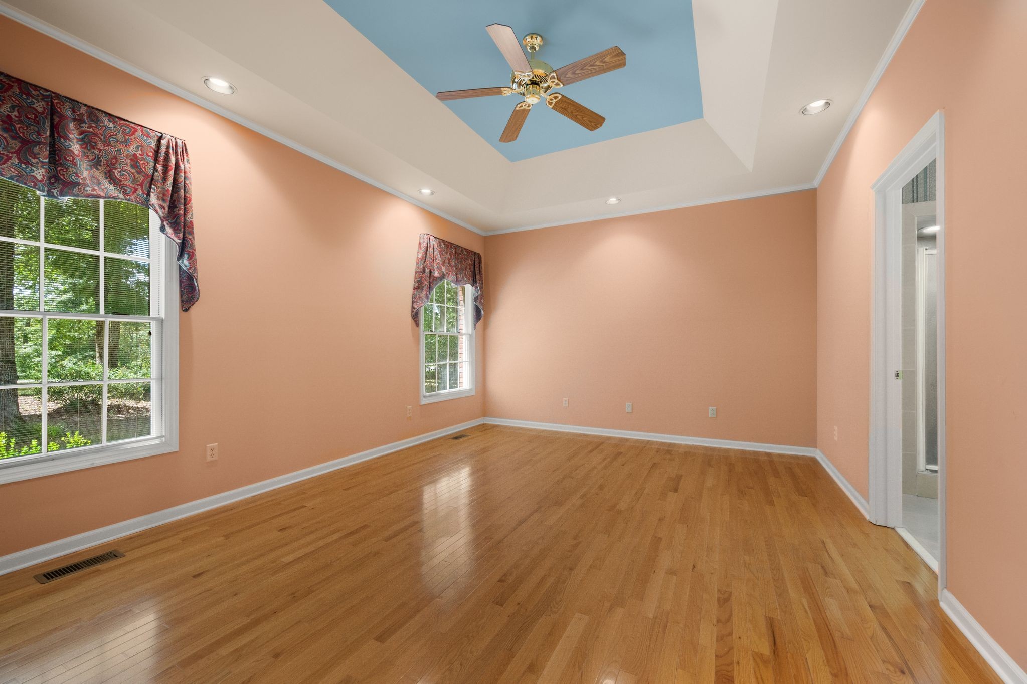 570 Gregson Place Waverly, TN 37185 - Photo 36 of 77 an empty room with wooden floor and windows